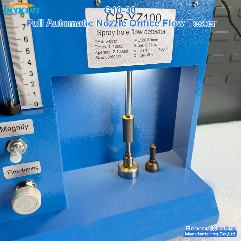Close-up of nozzle spray hole flow detector testing area with precision clamping. Close-up of nozzle spray hole flow detector testing area with precision clamping.