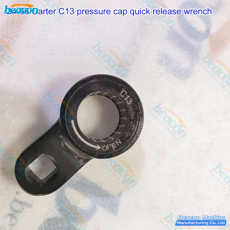 Close-up of G4-66 wrench showing laser-etched C13 markings and OPEN directional arrow