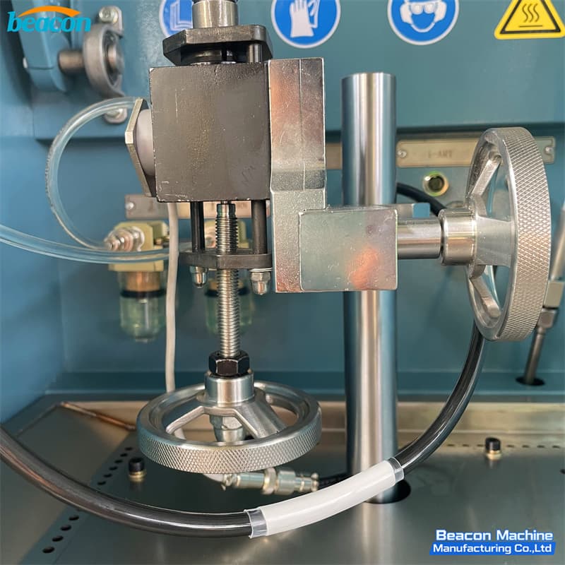 Close-up of precision manual handwheel for secure injector clamping on EPS206-PLUS.