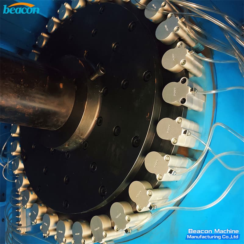 Close-up of the multi-line hydraulic manifold and nozzle system on the winding station Close-up of the multi-line hydraulic manifold and nozzle system on the winding station