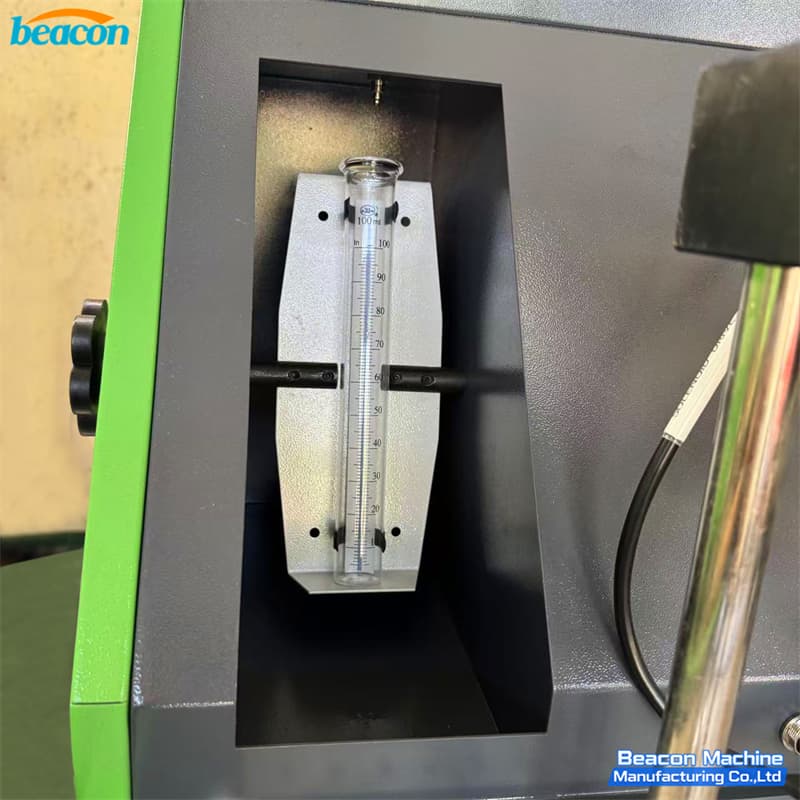 Close-up of the precision glass graduate cylinder for fuel return monitoring in HEUI-FS. Close-up of the precision glass graduate cylinder for fuel return monitoring in HEUI-FS.