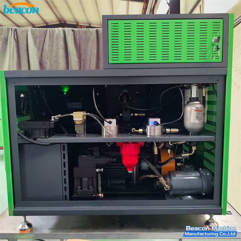 Internal mechanical compartment of BEACON MACHINE HEUI-FS showing motor and dual oil pumps. Internal mechanical compartment of BEACON MACHINE HEUI-FS showing motor and dual oil pumps.