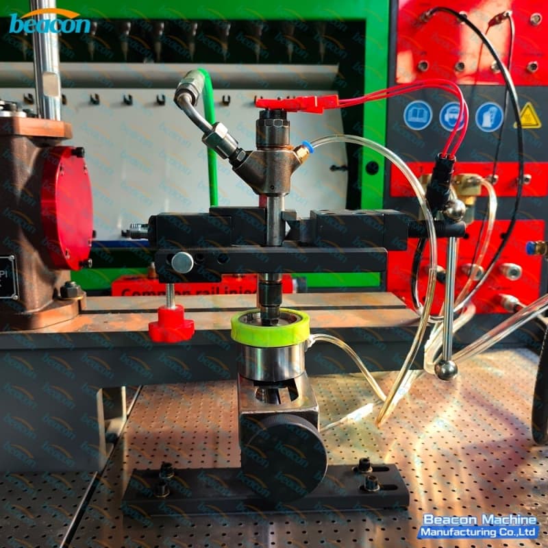 Close-up view of common rail diesel injector clamped on the heavy-duty bracket with high-pressure delivery pipe. Close-up view of common rail diesel injector clamped on the heavy-duty bracket with high-pressure delivery pipe.
