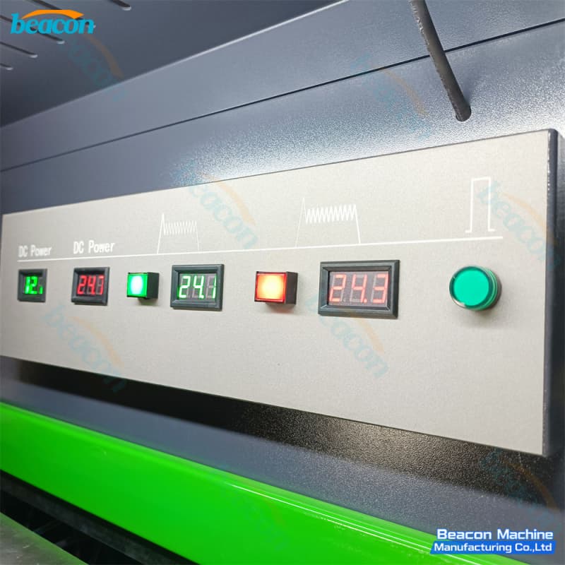 Upper interior view displaying real-time DC voltage readouts, safety warning plates, and multi-channel injector drive cables. Upper interior view displaying real-time DC voltage readouts, safety warning plates, and multi-channel injector drive cables.