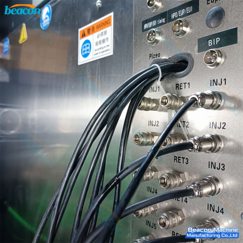 Stainless-steel electronic interface board highlighting dedicated quick-connect ports for INJ1-INJ8 and RET1-RET8. Stainless-steel electronic interface board highlighting dedicated quick-connect ports for INJ1-INJ8 and RET1-RET8.